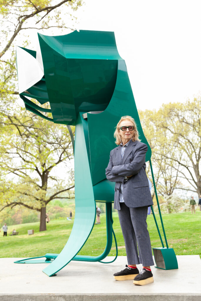 Artist Arlene Shechet stands in front of her sculpture Maiden May